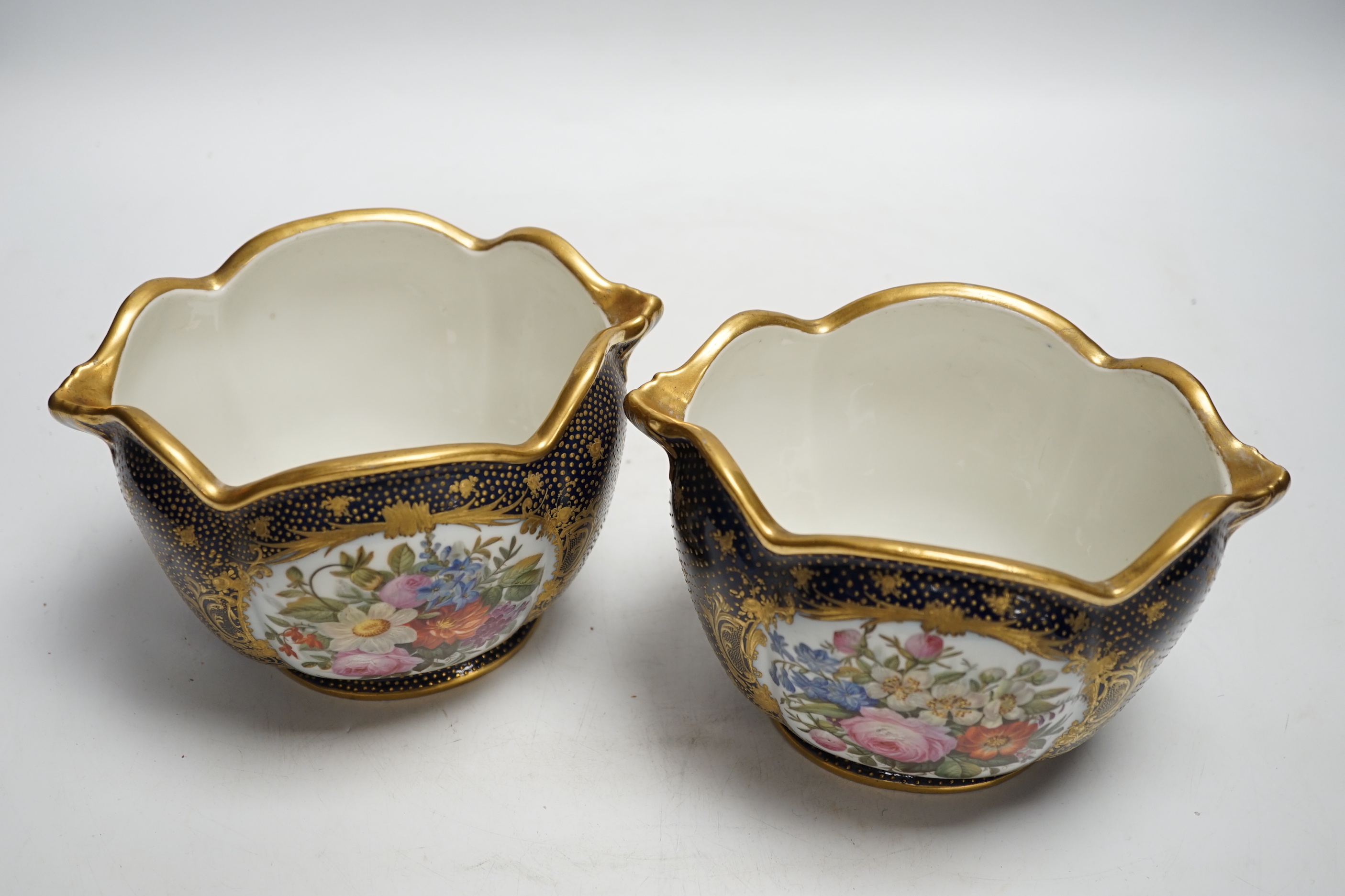 A pair of 19th century Paris porcelain cache pot hand painted with flowers and gilded decoration, 12cm high